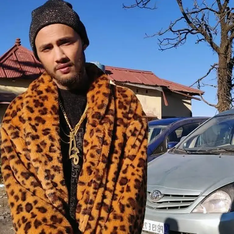Posing outdoors with a car