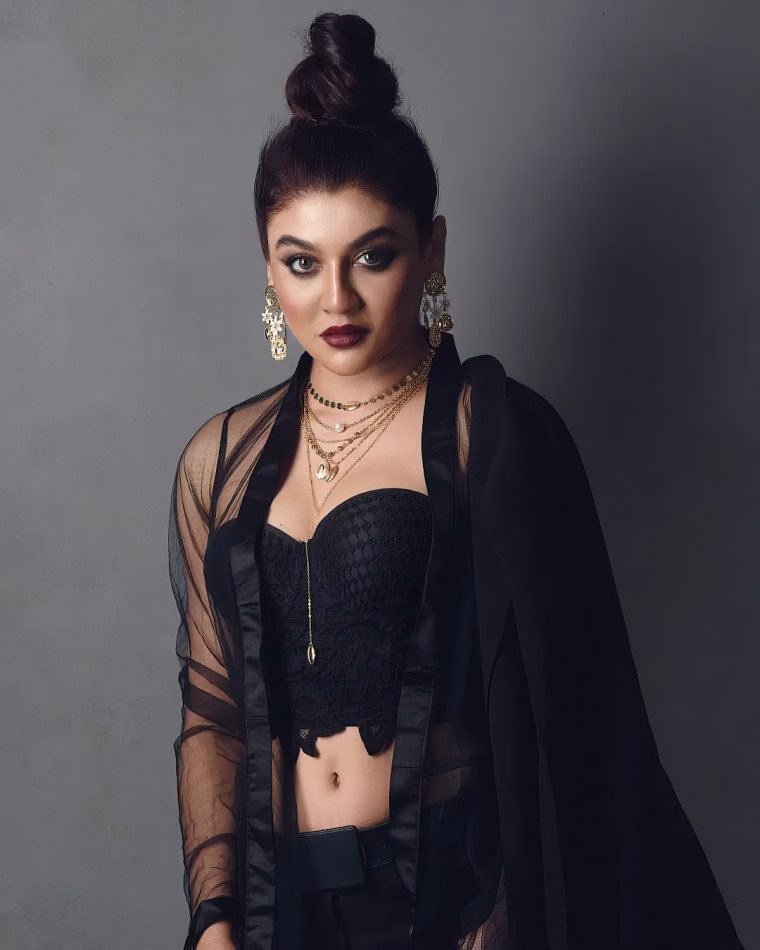 Jaya Ahsan posing in a black top